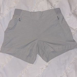 Calia workout shorts with zipper pockets. Gray